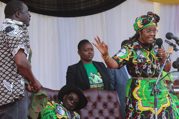 Presidents Robert Mugabe’s spokesperson George Charamba receiving a tongue-lashing at the hands of First Lady Grace Mugabe at a rally in Chinhoyi on Saturday
