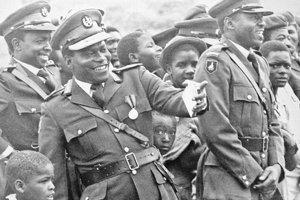 Solomon Mujuru aka Rex Nhongo (left) at a military review in Zimbabwe in 1981 