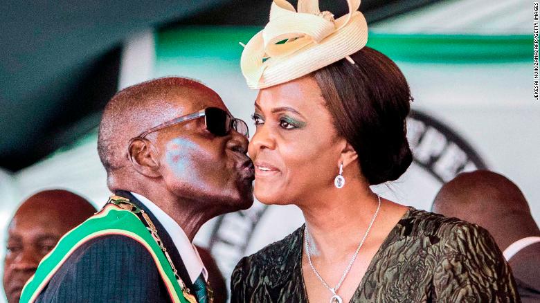 Mugabe kisses his wife Grace Mugabe during independence day celebrations in April.