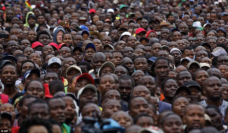 Protesters gather at a demonstration of tens of thousands at Zimbabwe Grounds in Harare, Zimbabwe on Saturday