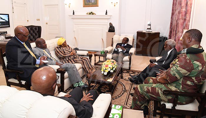 President Mugabe meets ZDF Commander and SA envoys at State House
