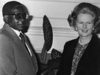 Mr Mugabe shakes hands with then prime minister Margaret Thatcher in 1980