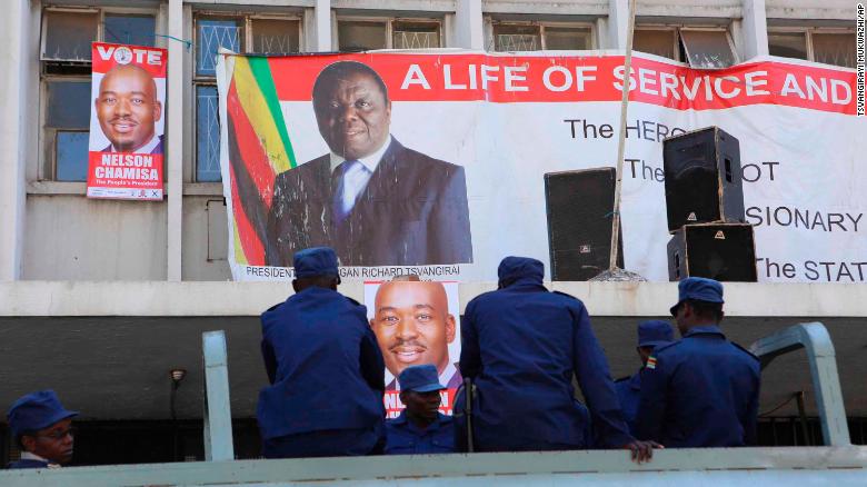 Zimbabwe police are seen outside the opposition party headquarters on Thursday.
