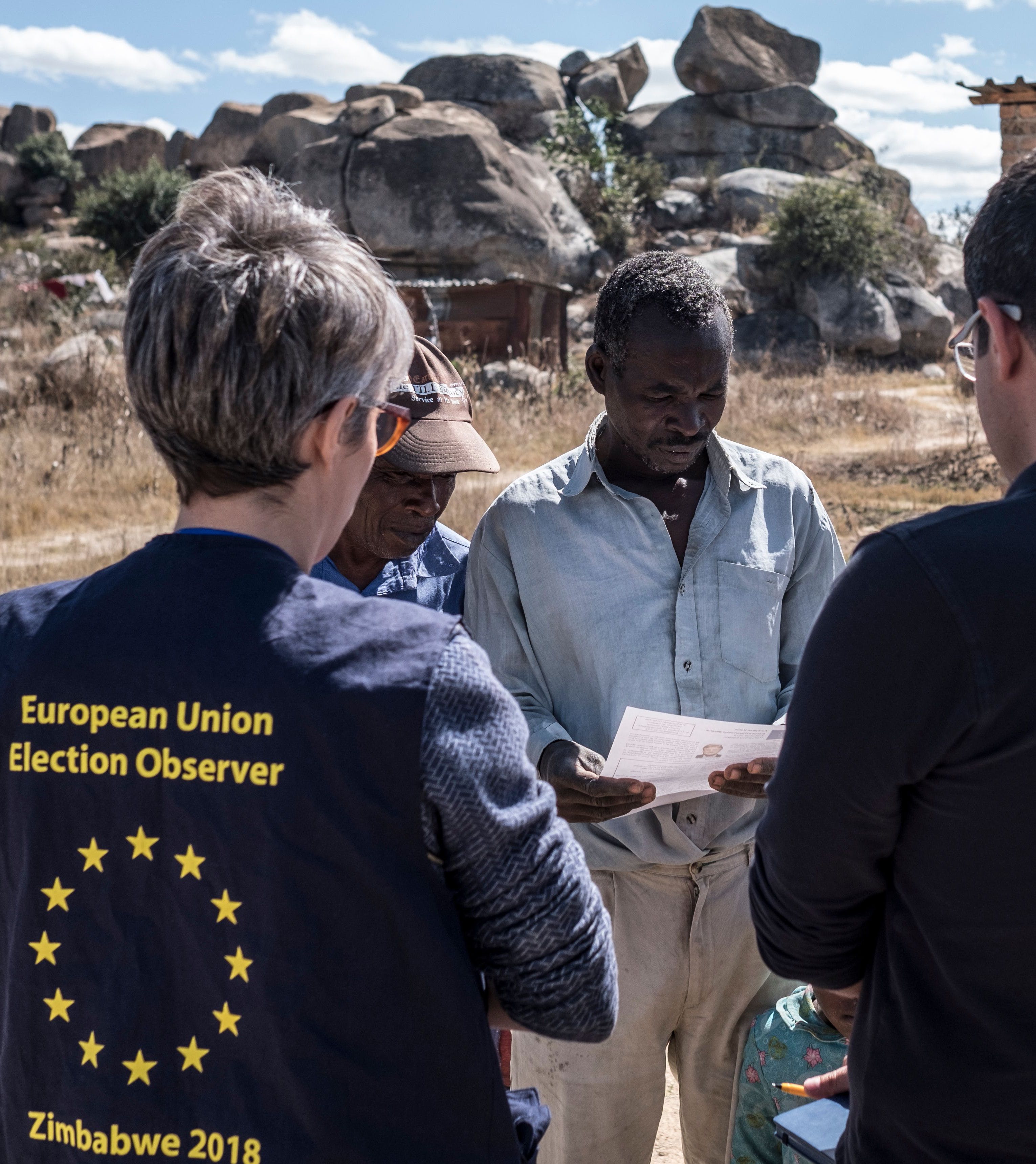 Members of a European Union election observation team speak to voters in Nyatsime, on July 24, 2018. - EU observers have been invited back into the country by the Zimbabwean Government for the first time after a key observer was expelled during the disputed 2002 presidential election. Zimbabwe will hold general elections on July 30, 2018. (Photo by MARCO LONGARI / AFP) (Photo credit should read MARCO LONGARI/AFP/Getty Images)