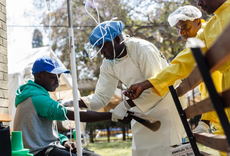File: A nurse takes care of a cholera patient during a visit of Zimbabwe Minister of Health, at the cholera treatment centre of the Beatrice Infectious Diseases Hospital, in Harare, on September 11, 2018. File: A nurse takes care of a cholera patient during a visit of Zimbabwe Minister of Health, at the cholera treatment centre of the Beatrice Infectious Diseases Hospital, in Harare, on September 11, 2018.