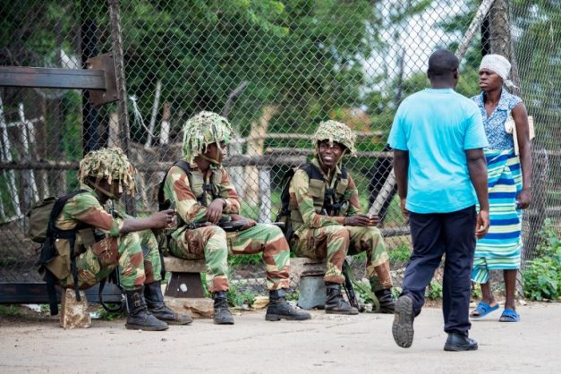Zimbabwean soldiers mount positions at entry points into the city of Bulawayo on January 17, 2019 as order is slowly restoring. - Nationwide demonstrations erupted on January 14 following a crippling strike over the increase in the price of fuel announced by Zimbabwean President to tackle a shortfall caused by increased demand and 