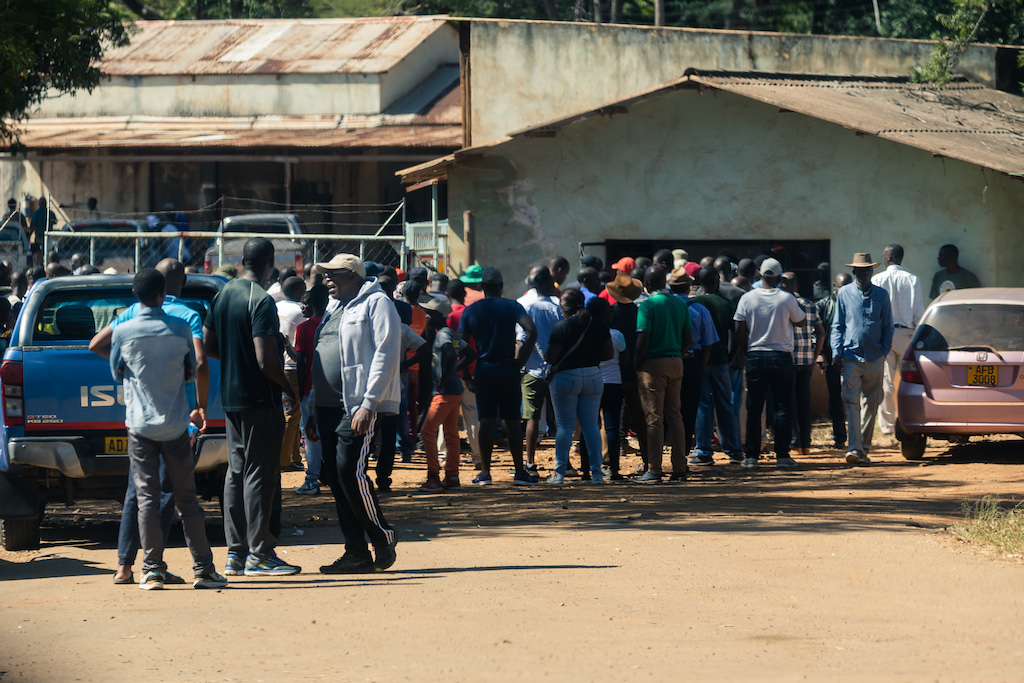 Potential buyers wait to register ahead of an auction for farming equipment, including broken down tractors and combine harvesters, at Robert Mugabe's Gushungo dairy farm in Mazowe, in Zimbabwe's Mashonaland Central province, on May 11, 2019.