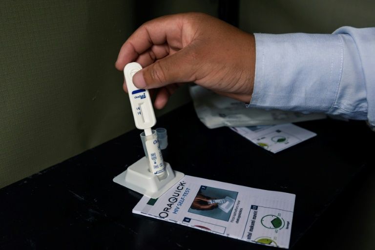 HIV self-testing kits are available at the one-stop clinics (AFP Photo/Jekesai NJIKIZANA)