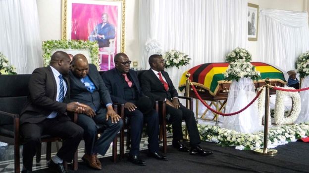 Movement for Democratic Change party leader Nelson Chamisa (R), vice-president Tendai Biti (2ndR) and vice-Chairman Job Sikhala (2ndL) attend the lying in state of Zimbabwe"s late president Robert Mugabe at the Mugabe"s Blue Roof residency in Harare on September 12, 2019
