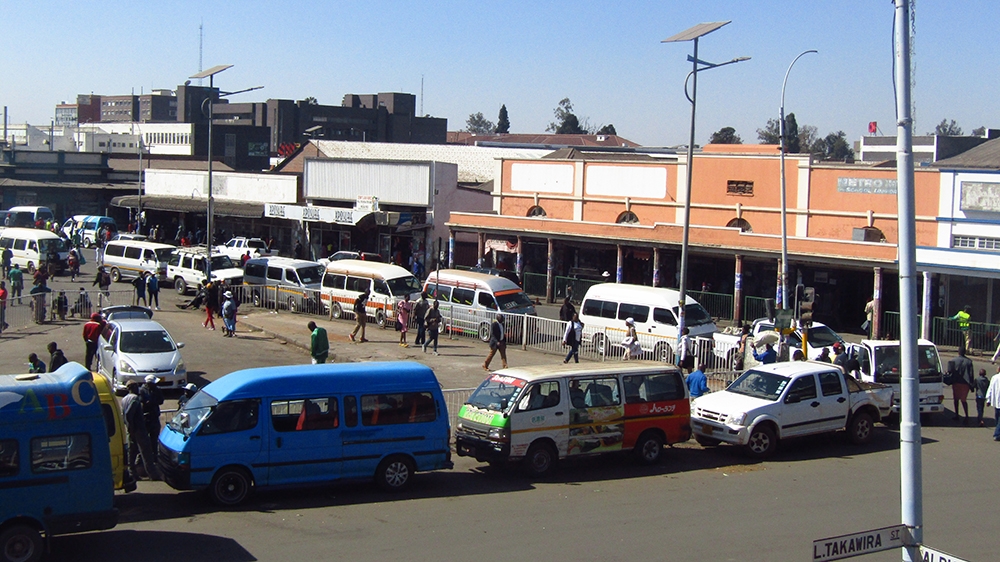 Buses queue to fill up, before Zimbabwean fuel prices rise again. Chris Murzoni/Al Jazeera Zimbabwe Fuel Prices 2
