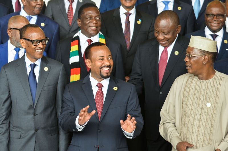 Ethiopian Prime Minister Abiy Ahmed and Zimbabwean President Emmerson Mnangagwa pose for a photo with other African leaders on the sidelines of a African Union summit in Addis Ababa on Nov. 17, 2018.