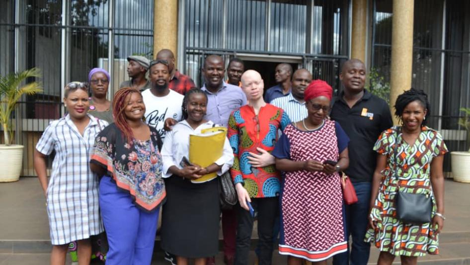 The seven activists, lawyer Jessie Majome (with yellow folder), family and friends outside Rotten Row Magistrates Court on January 8, 2020.