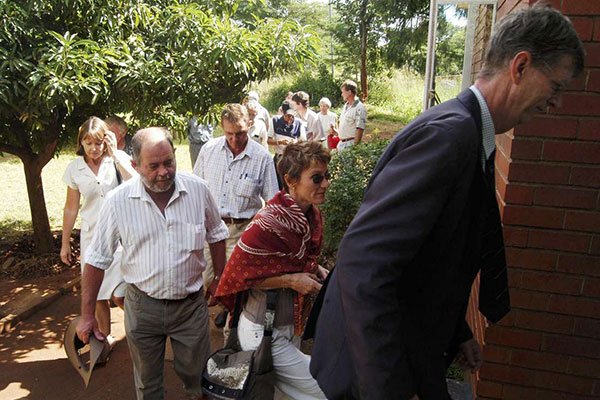 Lawyer David Drury leads a group of white