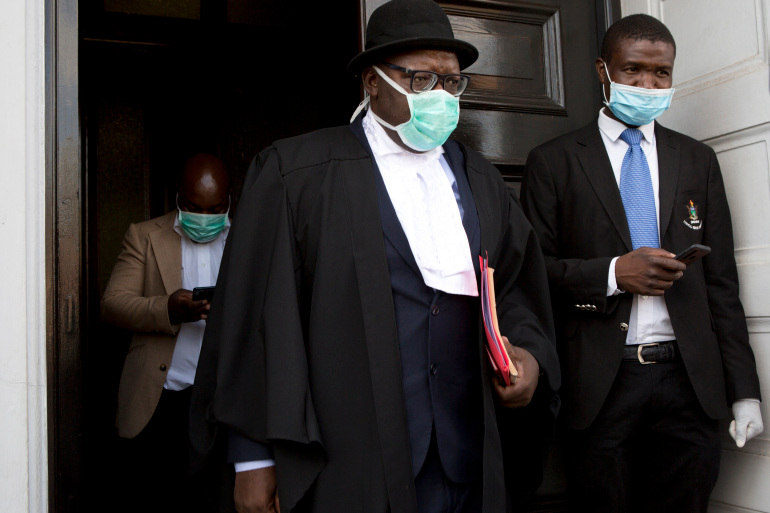 Zimbabwean lawyer Tendai Biti, 53, was freed on $10,000 bail after a night behind bars [File: Tsvangirayi Mukwazhi/AP Photo]