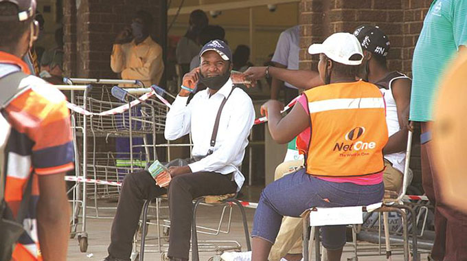 Money changers camp outside shops