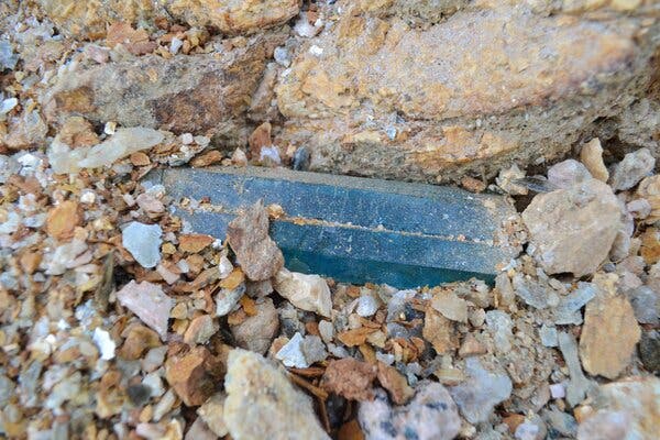 A piece of aquamarine, used in jewelry, is uncovered at Zimbaqua.