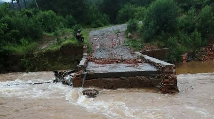Heavy rains sweep away bridge, damage 19 houses