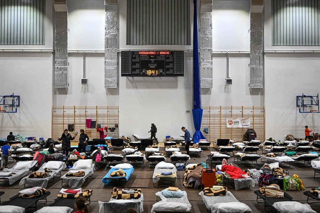 Women and children rest inside the sports hall of a primary school which has been converted to a refugee center on March 01, 2022 in Przemysl, Poland. According to the United Nations, Poland has so far received at least 281,000 refugees from Ukraine since Russia invaded on February 24. Meanwhile, battles are raging across Ukraine between Ukrainian armed forces and the invading Russian army. (Photo by Omar Marques/Getty Images)