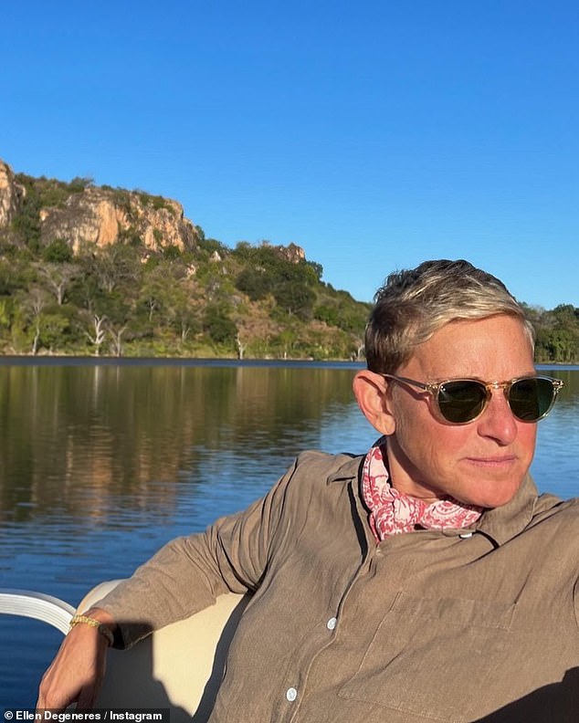 Scenery: In another picture, Ellen was also seen out on a boat, taking in the local sights while out on the water, with the view of the mountains behind her