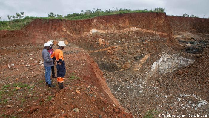 Workers inspect an open cast at Arcadia Lithium mine on January 11, 2022 in Goromonzi, Zimbabwe. Workers inspect an open cast at Arcadia Lithium mine on January 11, 2022 in Goromonzi, Zimbabwe.