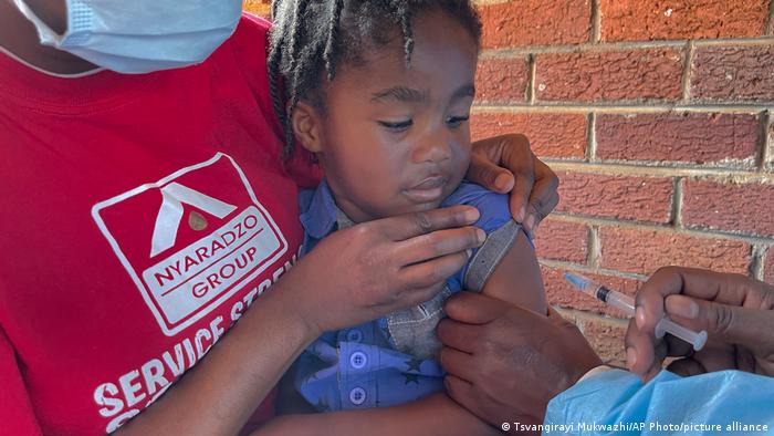 A child receives a measles vaccination jab at a local clinic in Harare