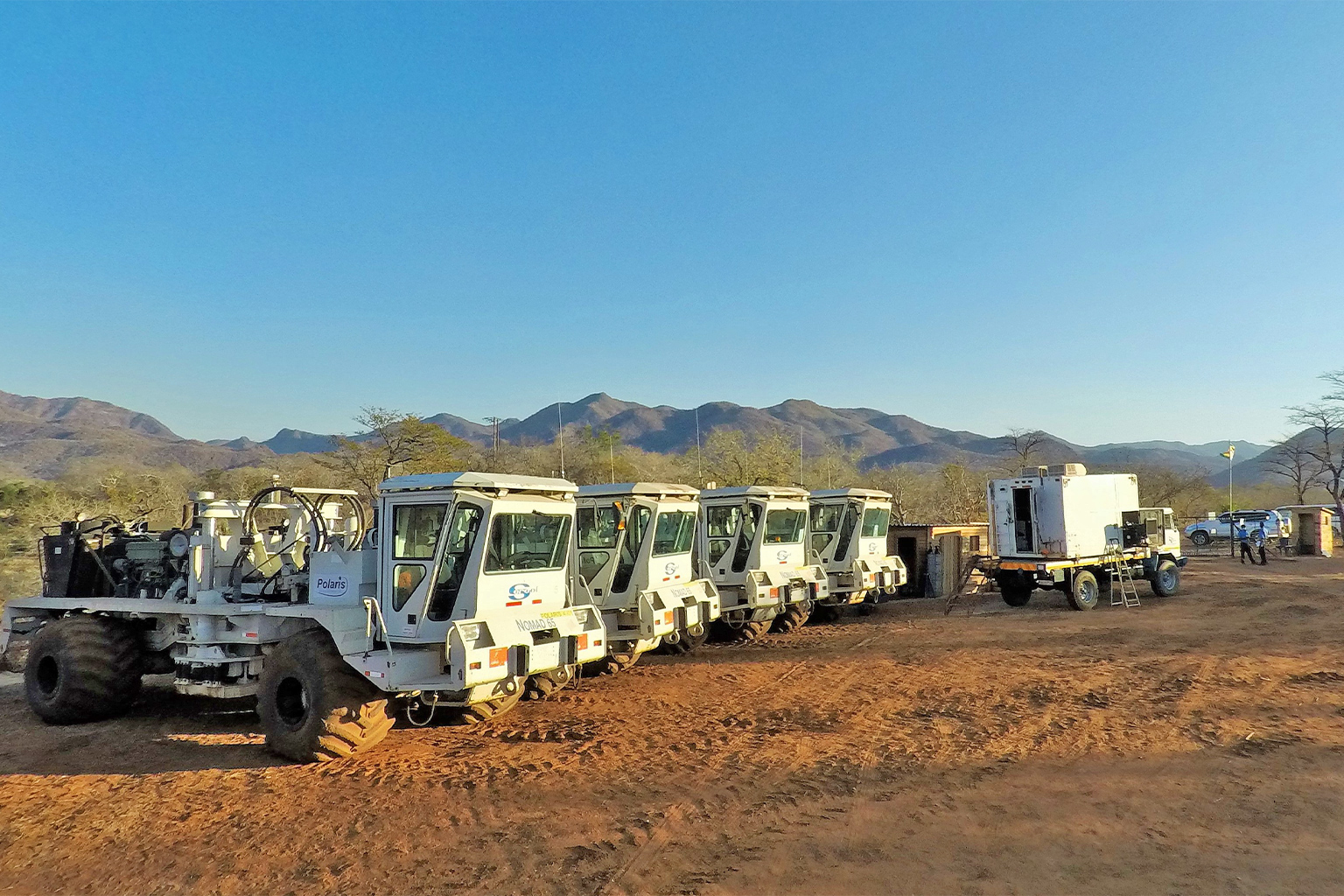Vibroseis trucks.