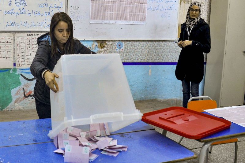 An ISIE agent begins counting ballots at a polling station in Tunis, Tunisia, during parliamentary elections on Dec. 17.