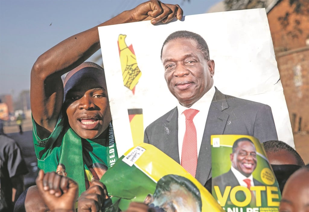 People in Mbare, a suburb in Harare, celebrate Zanu-PF’s Emmerson Mnangagwa as president of Zimbabwe.