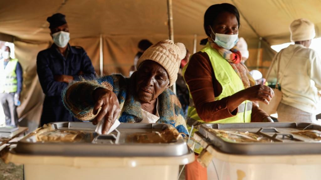 A woman casts her ballot at a polling station during the presidential and legislative elections in Mbare, Harare. A woman casts her ballot at a polling station duri