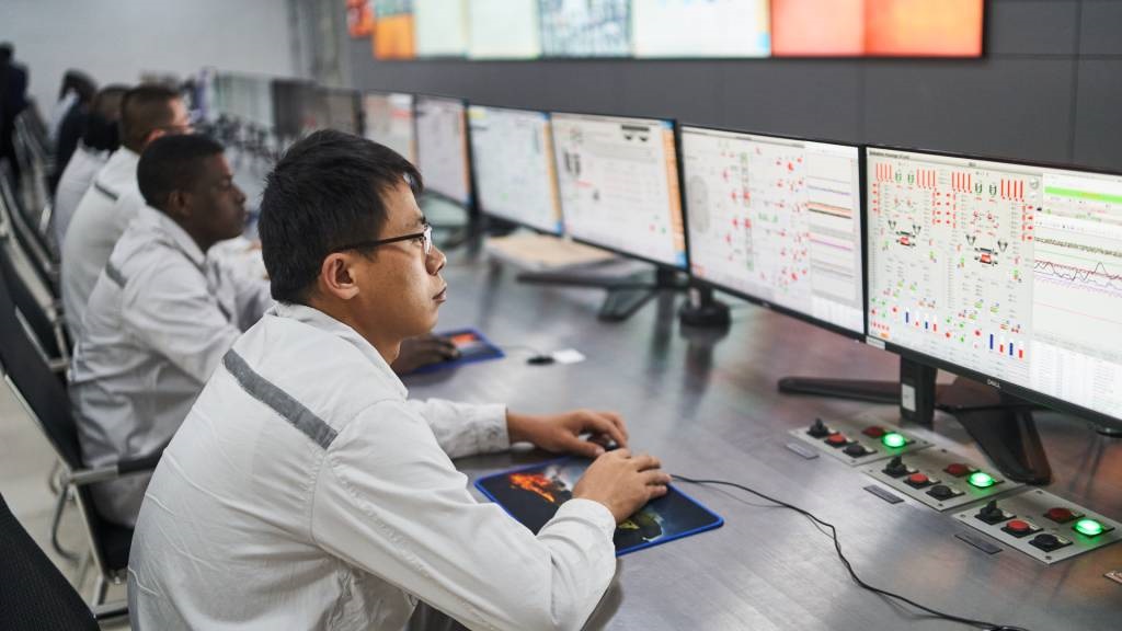 Engineers monitor digital systems at a recently upgraded coal powered electricity generator in Hwange, Zimbabwe. Engineers monitor digital systems at a recently up
