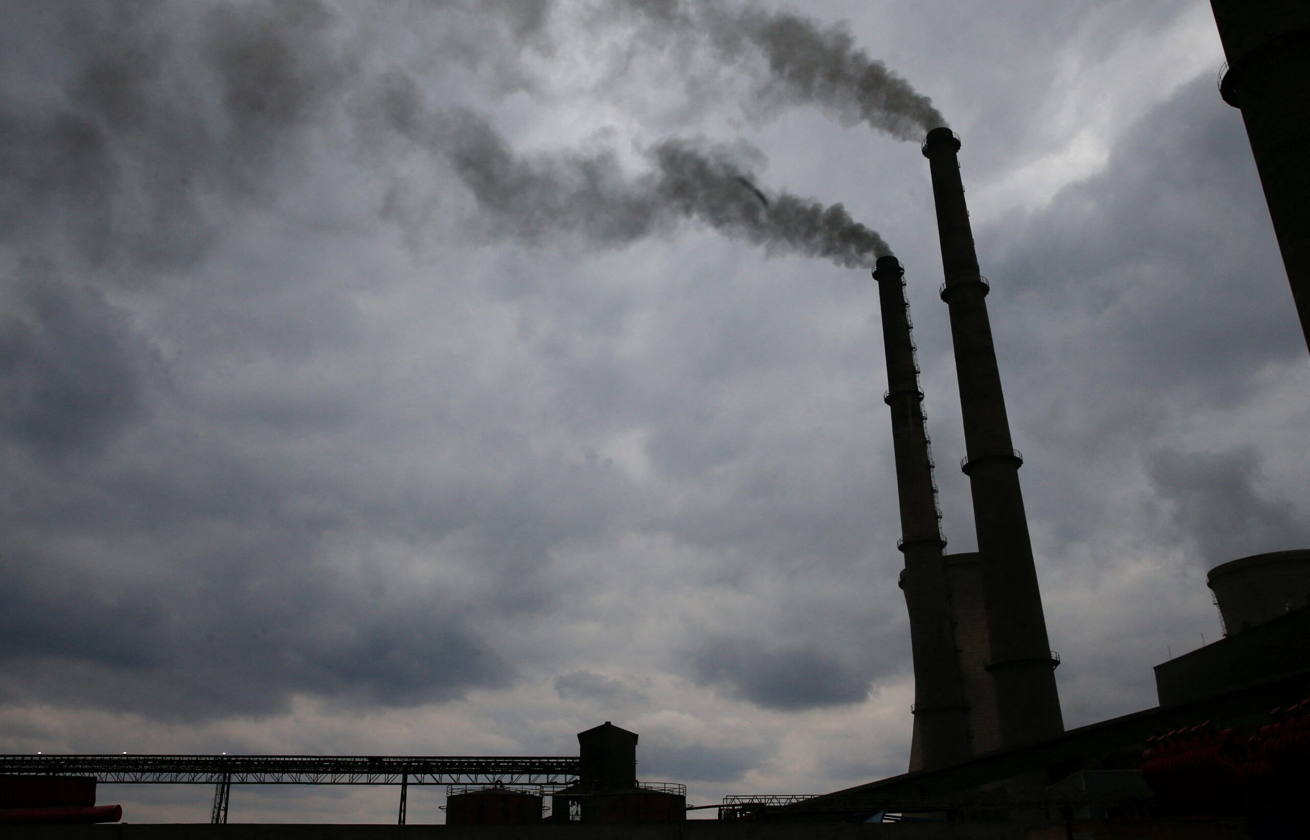 Smoke rises from chimneys at Hwange Power station in Hwange