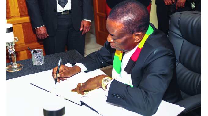 President signs Nujoma condolences book