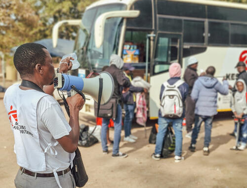 Douglas Zulu addresses a group of Zimbabwean returnees at the Beitbridge Reception Centre before they continue their journey home. As one of four MSF Community Health Workers at the centre, he delivers daily health education sessions and connects returnees to essential health and support services. MSF is working alongside the Ministry of Health and Child Care to provide medical care and

humanitarian assistance to the growing number of Zimbabweans returning from South Africa following anti-migrant protests.